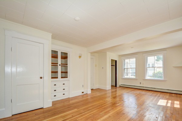 7 Martin Street Maynard, MA 01754 - Photo 9 of 28 an empty room with window and wooden floor