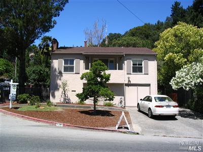 a house view with a garden space