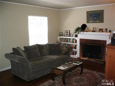125 Butterfield Road San Anselmo, CA 94960 - Photo 3 of 10 a living room with furniture a rug and a fireplace
