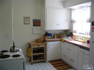 125 Butterfield Road San Anselmo, CA 94960 - Photo 5 of 10 a kitchen with a sink cabinets and window