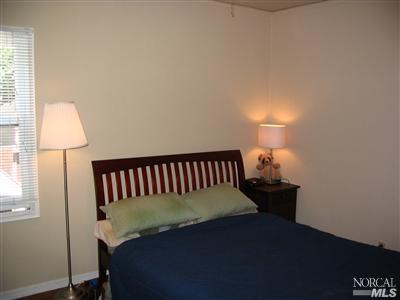 125 Butterfield Road San Anselmo, CA 94960 - Photo 9 of 10 a bed sitting in a bedroom next to a window
