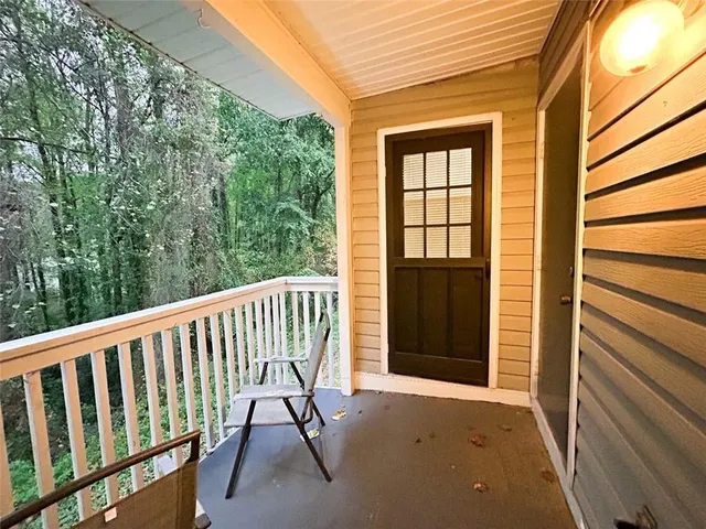 a view of balcony with wooden floor