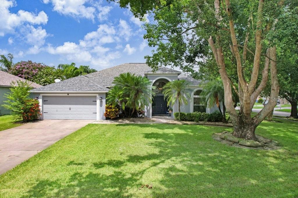 829 Innergary Place Valrico, FL 33594 - Photo 1 of 30 a view of a house with a yard and potted plants