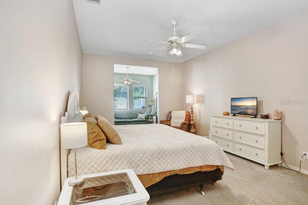 829 Innergary Place Valrico, FL 33594 - Photo 11 of 30 a bedroom with a bed and furniture