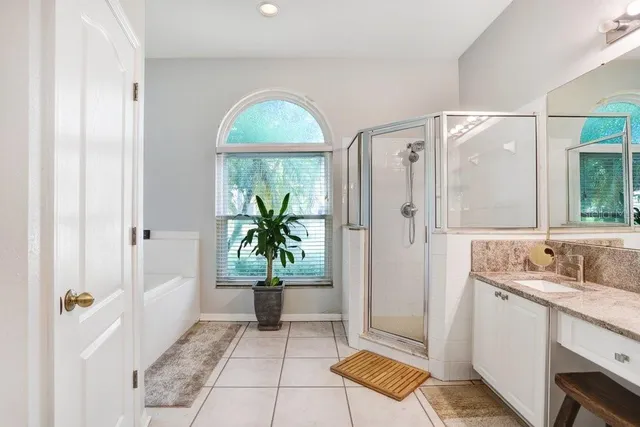 a bathroom with a tub and shower