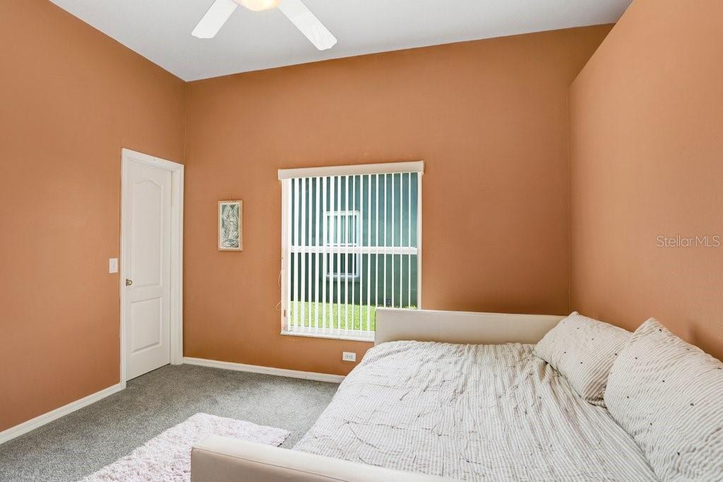829 Innergary Place Valrico, FL 33594 - Photo 14 of 30 a bedroom with a bed and a window