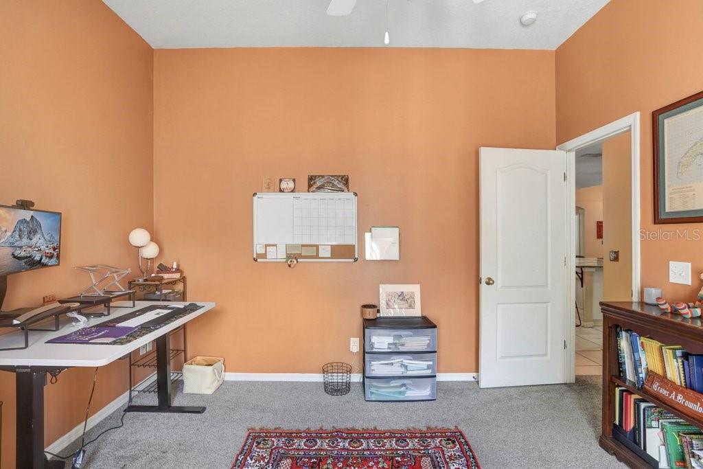 829 Innergary Place Valrico, FL 33594 - Photo 18 of 30 a room with furniture and a book shelf