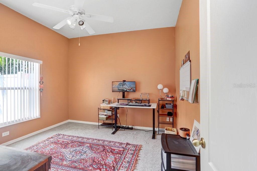 829 Innergary Place Valrico, FL 33594 - Photo 19 of 30 a view of a workspace with furniture and a window