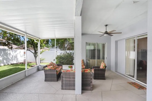 a balcony with furniture and a garden