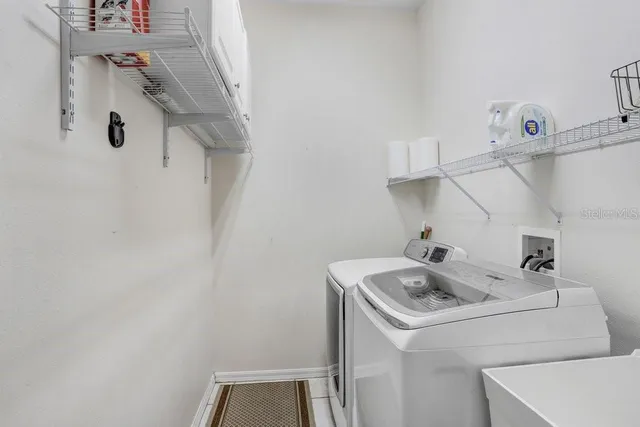 a bathroom with a sink and washing machine