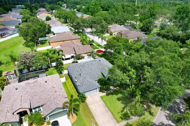 an aerial view of house with yard