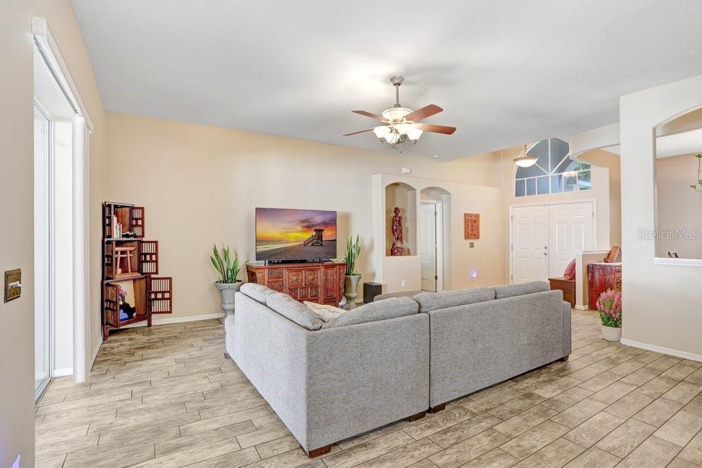 829 Innergary Place Valrico, FL 33594 - Photo 6 of 30 a living room with furniture and a flat screen tv
