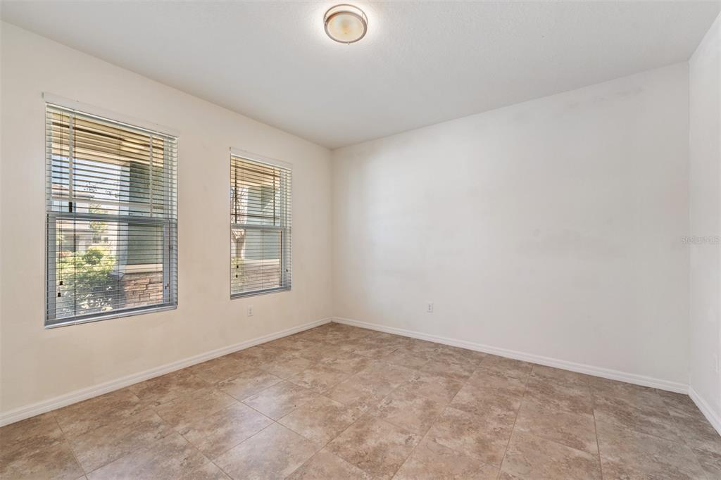1570 Fox Grape Loop Lutz, FL 33558 - Photo 13 of 41 an empty room with windows