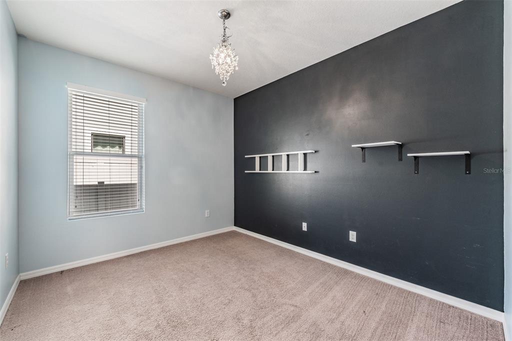 1570 Fox Grape Loop Lutz, FL 33558 - Photo 19 of 41 a view of an empty room with a window