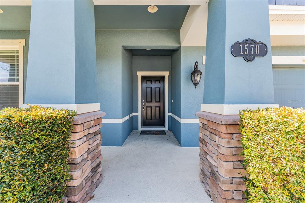 1570 Fox Grape Loop Lutz, FL 33558 - Photo 2 of 41 a living room with a couch and a table
