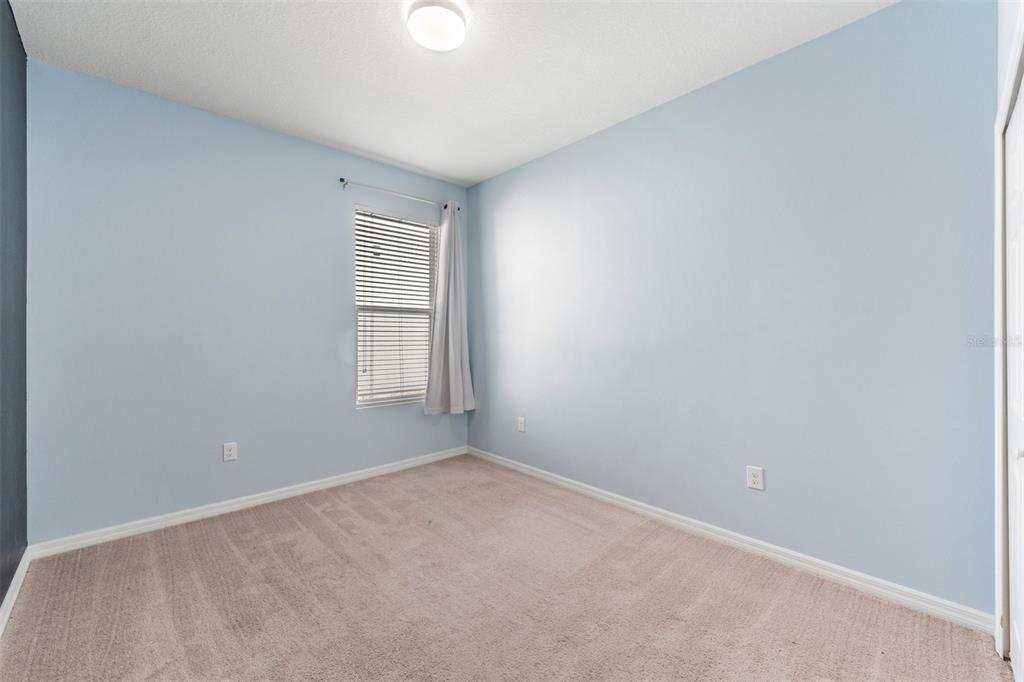 1570 Fox Grape Loop Lutz, FL 33558 - Photo 21 of 41 an empty room with a window