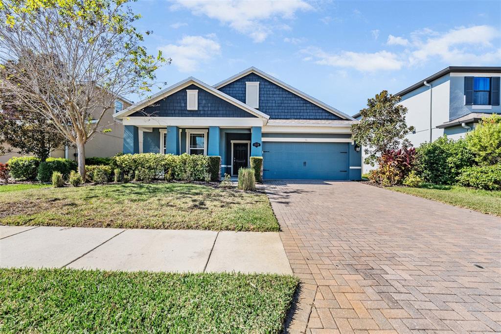 1570 Fox Grape Loop Lutz, FL 33558 - Photo 26 of 41 a front view of a house with yard and trees