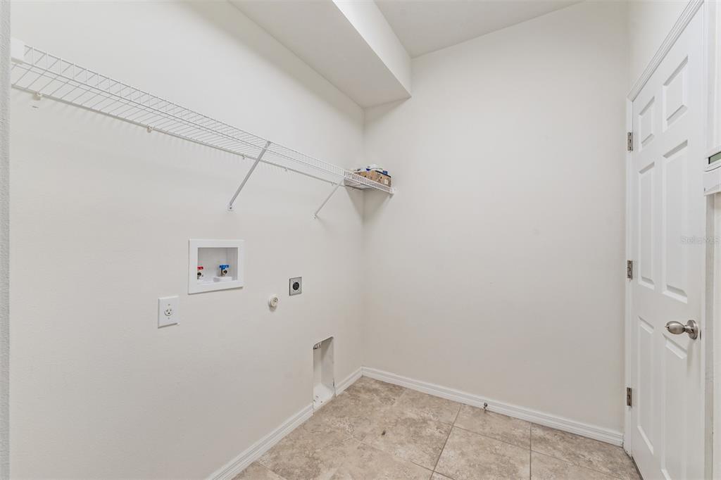 1570 Fox Grape Loop Lutz, FL 33558 - Photo 35 of 41 a view of a room with racks on the wall