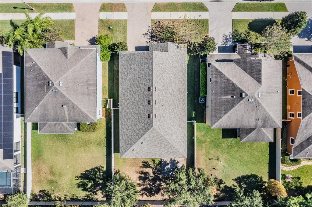 1570 Fox Grape Loop Lutz, FL 33558 - Photo 39 of 41 an aerial view of a house with a yard and large trees