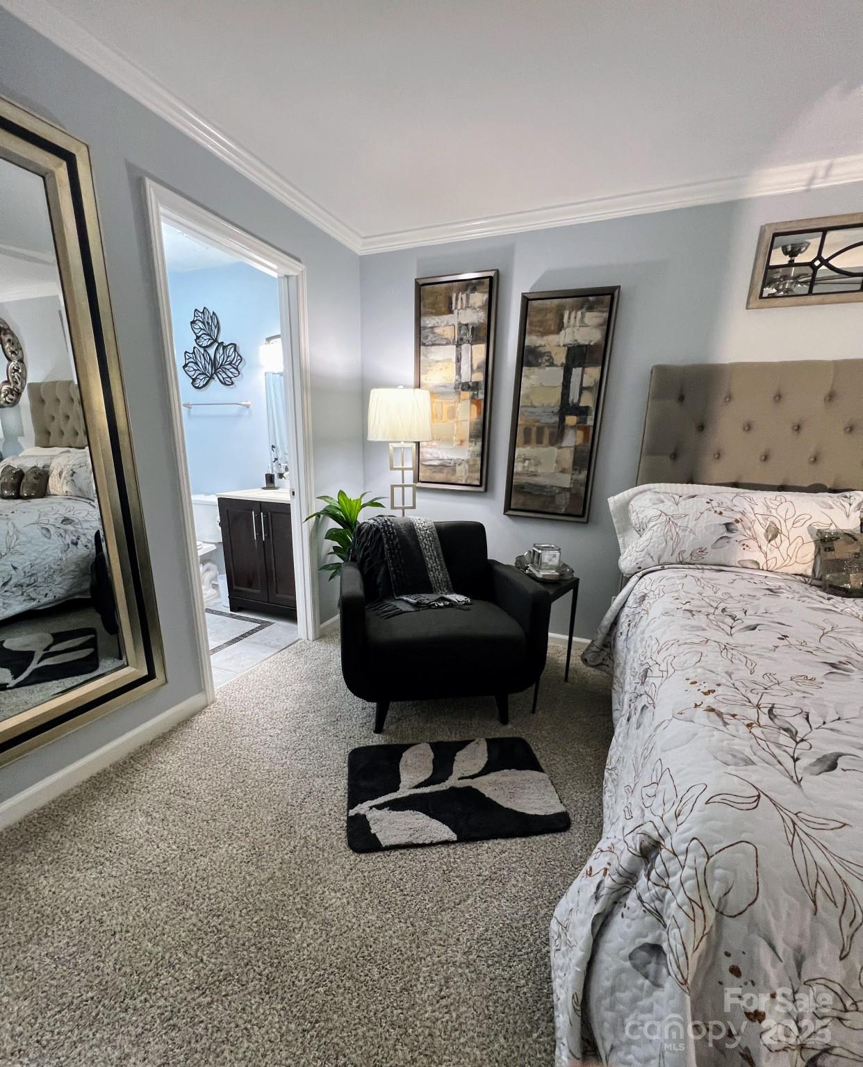 109 Stroupe Road, Unit E Gastonia, NC 28056 - Photo 14 of 25 a living room with furniture a bed and a dresser next to a window