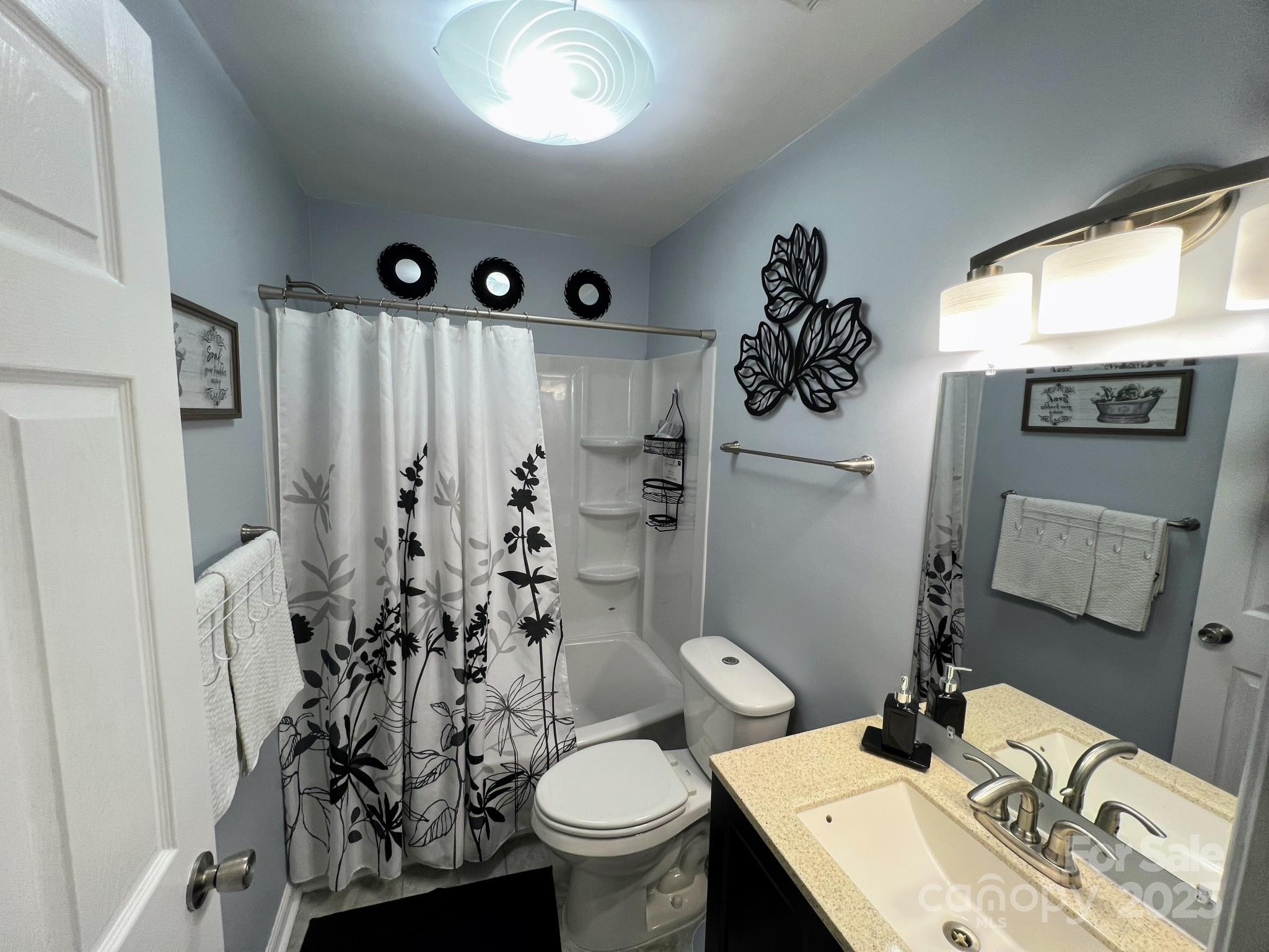 109 Stroupe Road, Unit E Gastonia, NC 28056 - Photo 15 of 25 a bathroom with a sink toilet and shower