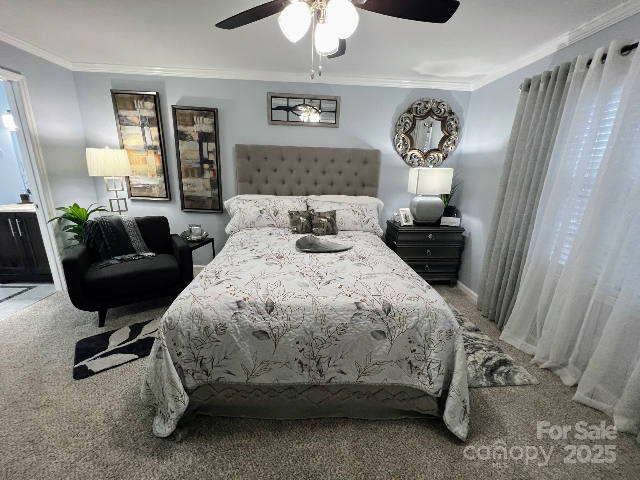 109 Stroupe Road, Unit E Gastonia, NC 28056 - Photo 23 of 25 a bedroom with a bed and a chandelier