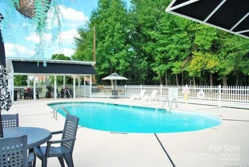 109 Stroupe Road, Unit E Gastonia, NC 28056 - Photo 5 of 25 a view of a swimming pool with a patio