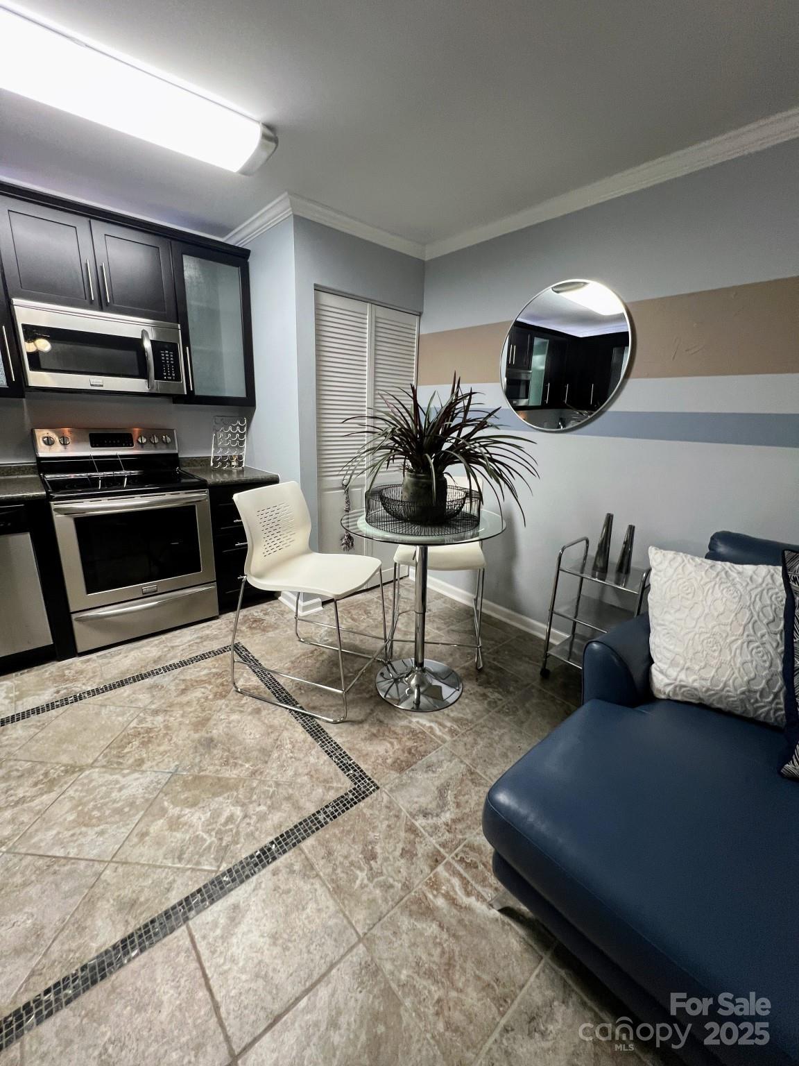 109 Stroupe Road, Unit E Gastonia, NC 28056 - Photo 9 of 25 a living room with furniture and kitchen view