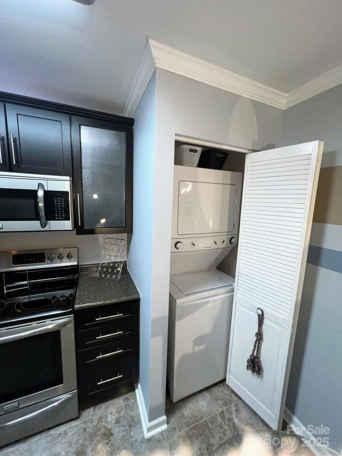 109 Stroupe Road, Unit E Gastonia, NC 28056 - Photo 10 of 25 a kitchen with a refrigerator and a stove