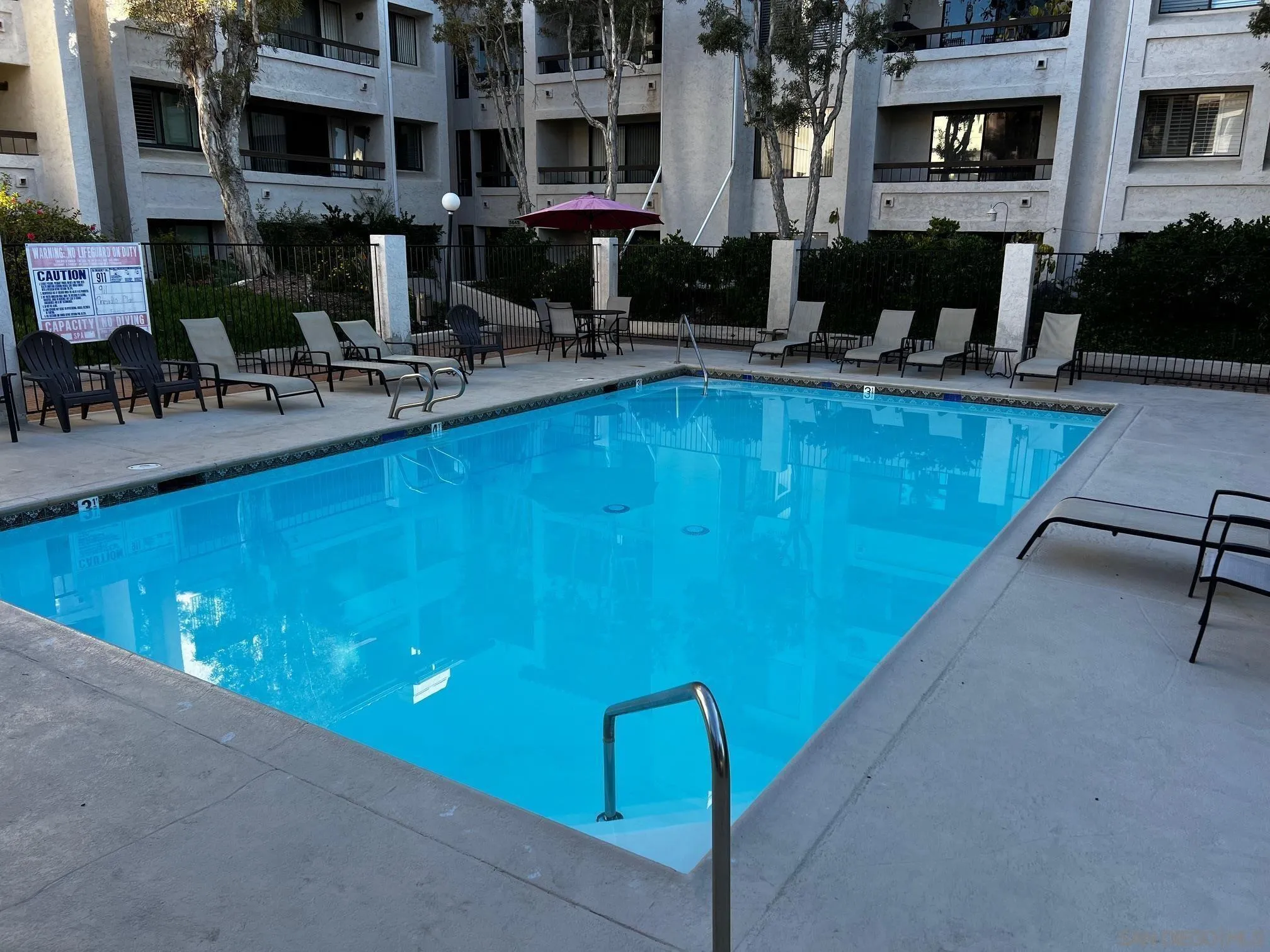 5705 Friars Road, Unit 22 San Diego, CA 92110 - Photo 1 of 38 a view of a swimming pool with outdoor seating