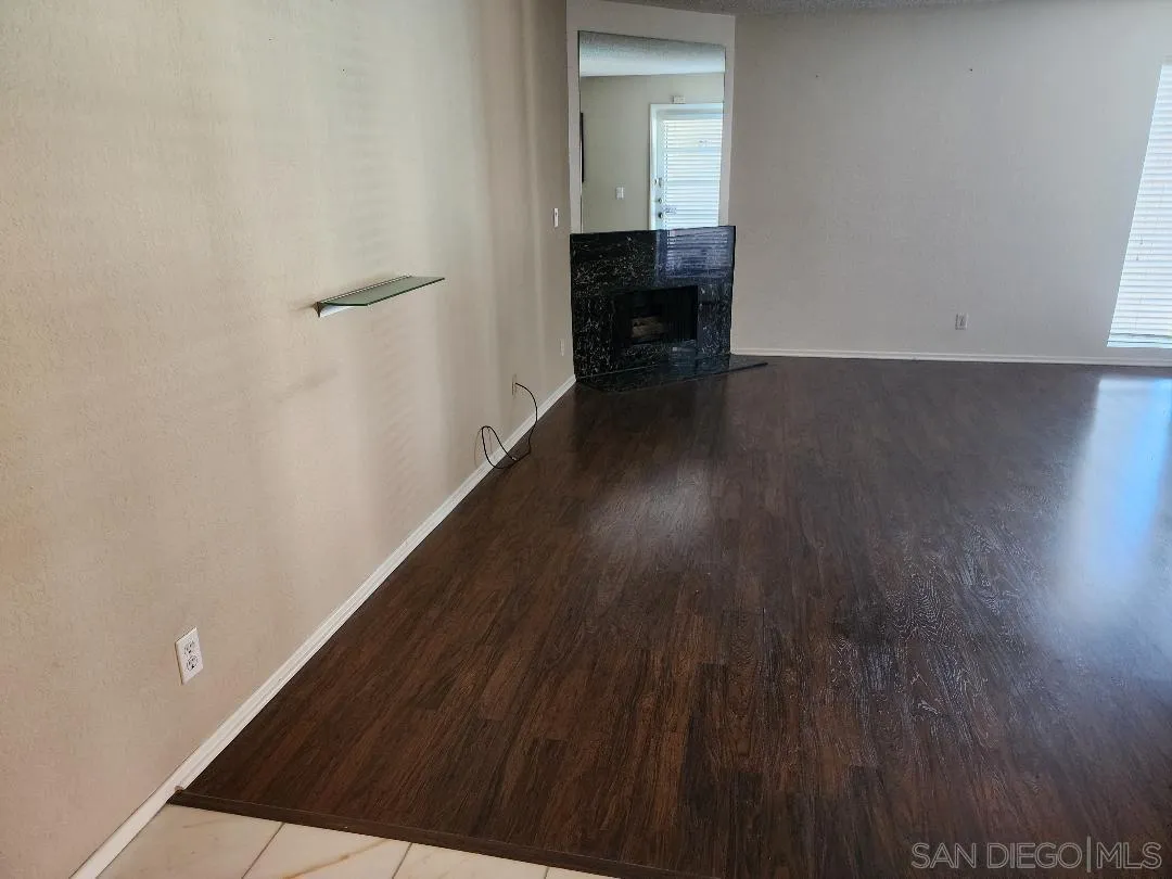 5705 Friars Road, Unit 22 San Diego, CA 92110 - Photo 21 of 38 a view of a hallway with wooden floor and staircase