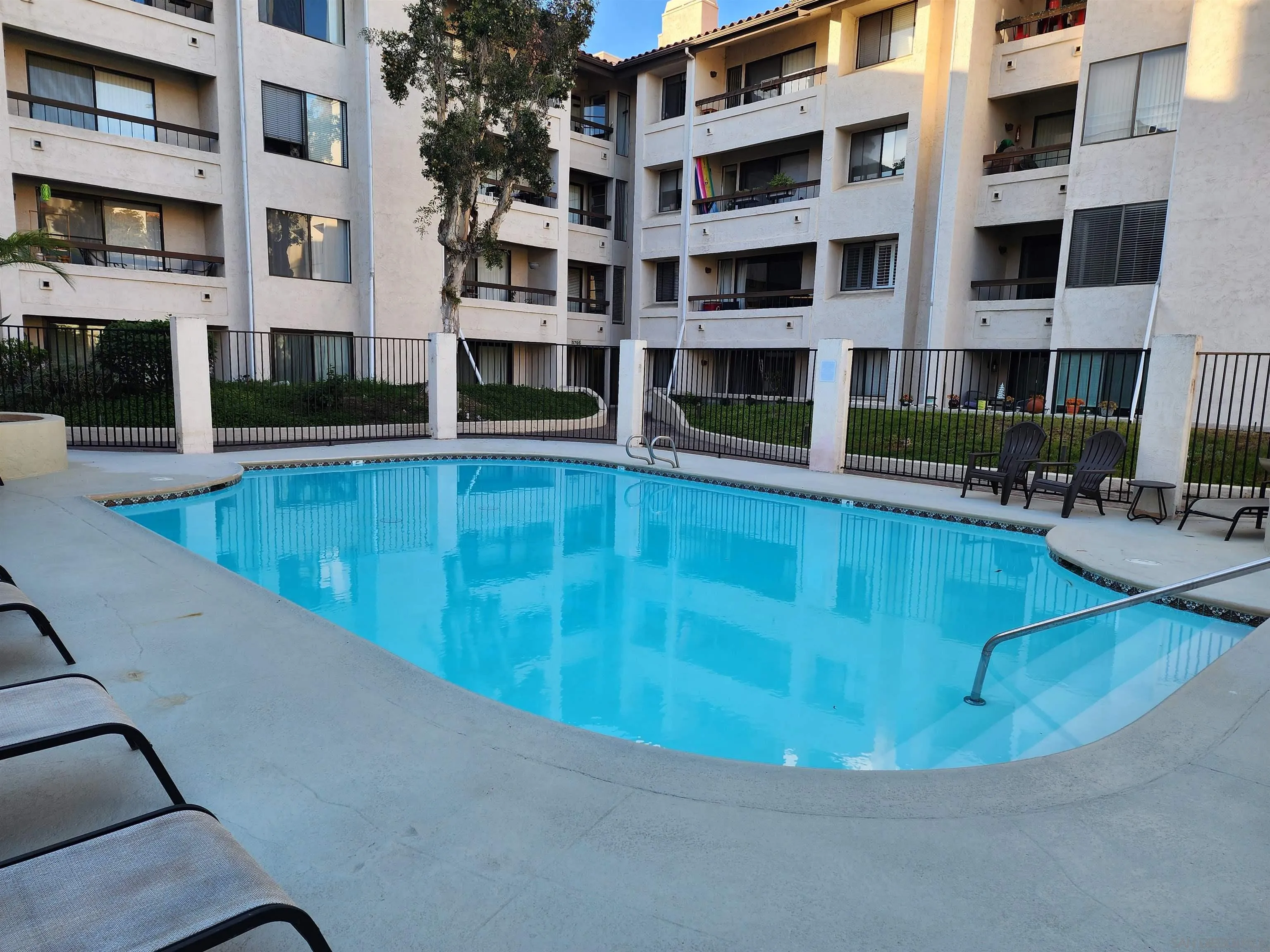5705 Friars Road, Unit 22 San Diego, CA 92110 - Photo 31 of 38 a view of large building with a swimming pool