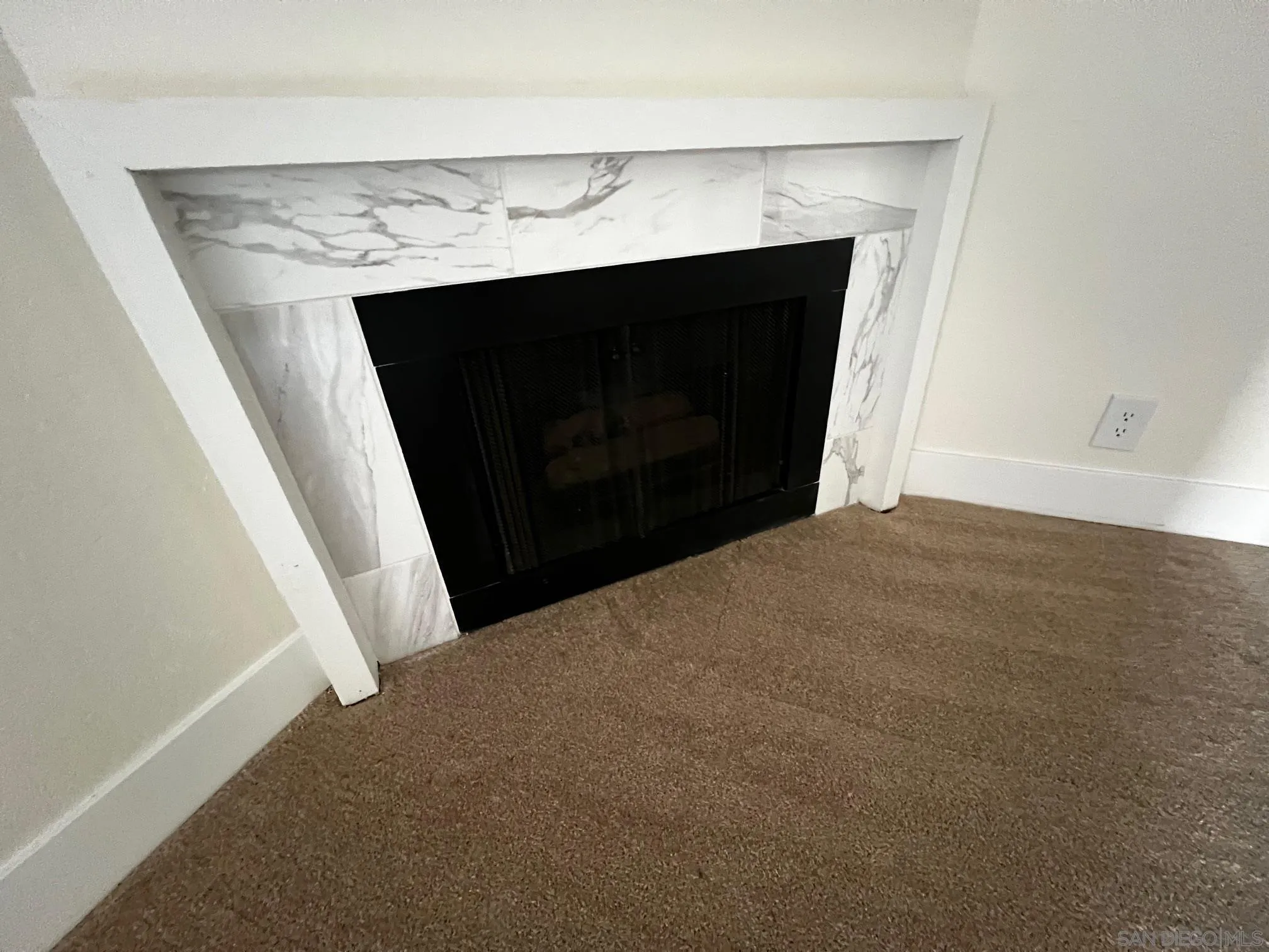 5705 Friars Road, Unit 22 San Diego, CA 92110 - Photo 5 of 38 a view of empty room with a fireplace