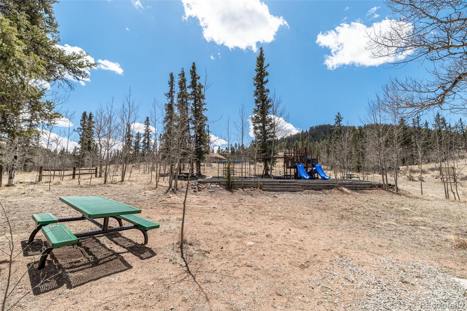 858 Red Cloud Road Jefferson, CO 80456 - Photo 11 of 32 a view of a yard with a sitting area