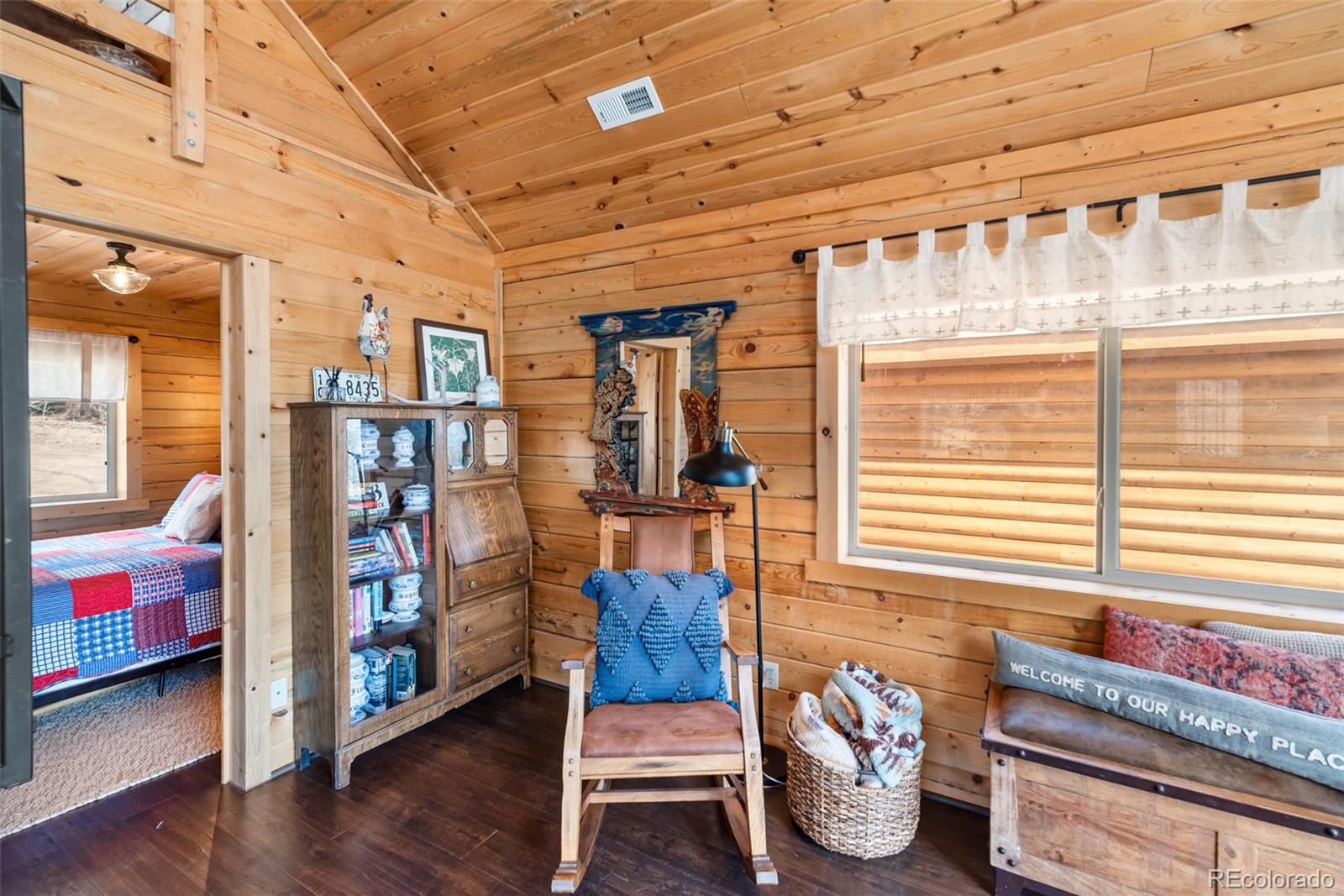 858 Red Cloud Road Jefferson, CO 80456 - Photo 15 of 32 a bedroom with furniture and a window