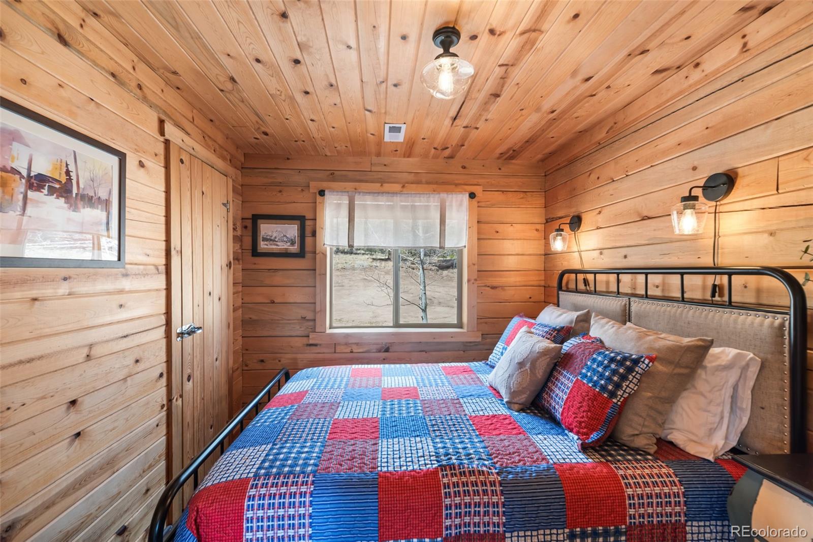 858 Red Cloud Road Jefferson, CO 80456 - Photo 27 of 32 a bedroom with a bed and a window