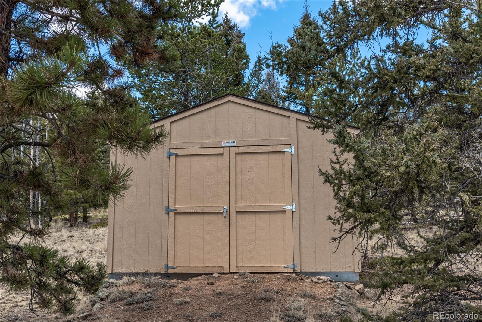 858 Red Cloud Road Jefferson, CO 80456 - Photo 7 of 32 a house with trees in front of it