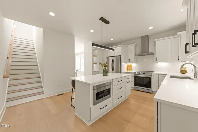 a view of a hallway with staircase