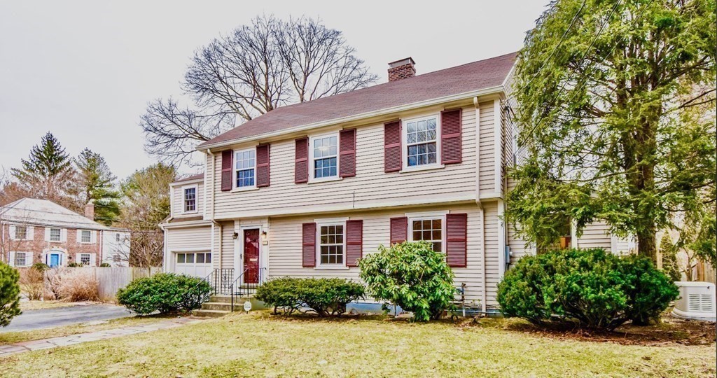 77 Hagen Road Newton, MA 02459 - Photo 1 of 18 a front view of a house with a yard and potted plants