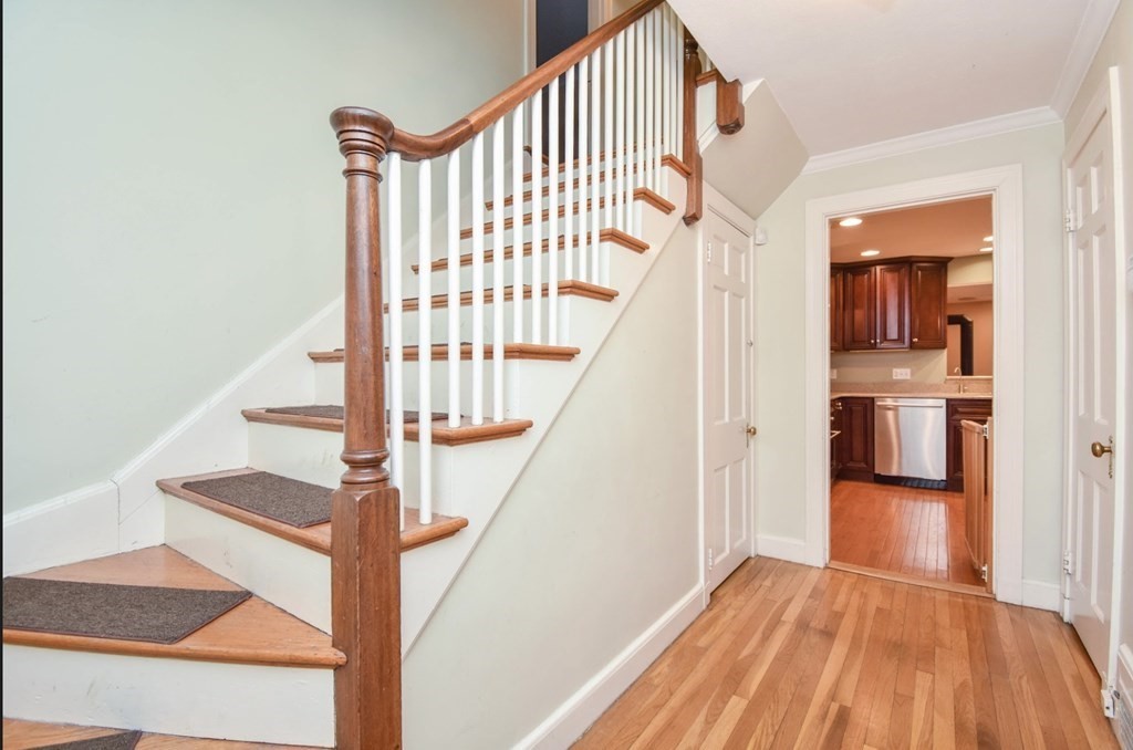 77 Hagen Road Newton, MA 02459 - Photo 14 of 18 a view of entryway and hall with wooden floor