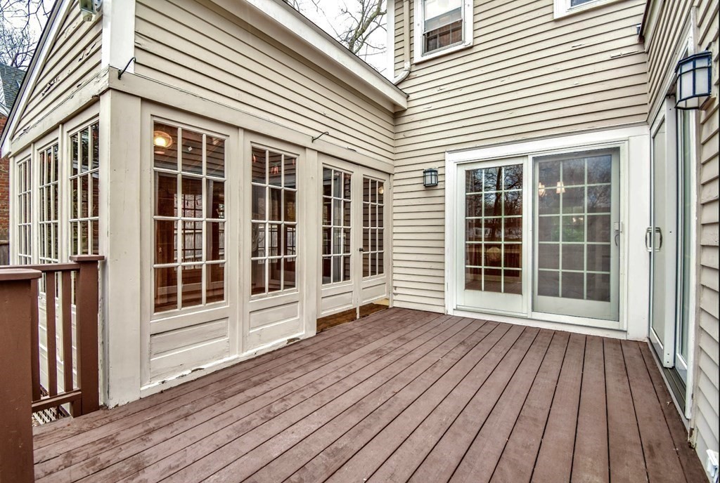 77 Hagen Road Newton, MA 02459 - Photo 9 of 18 an empty room with wooden floor and windows