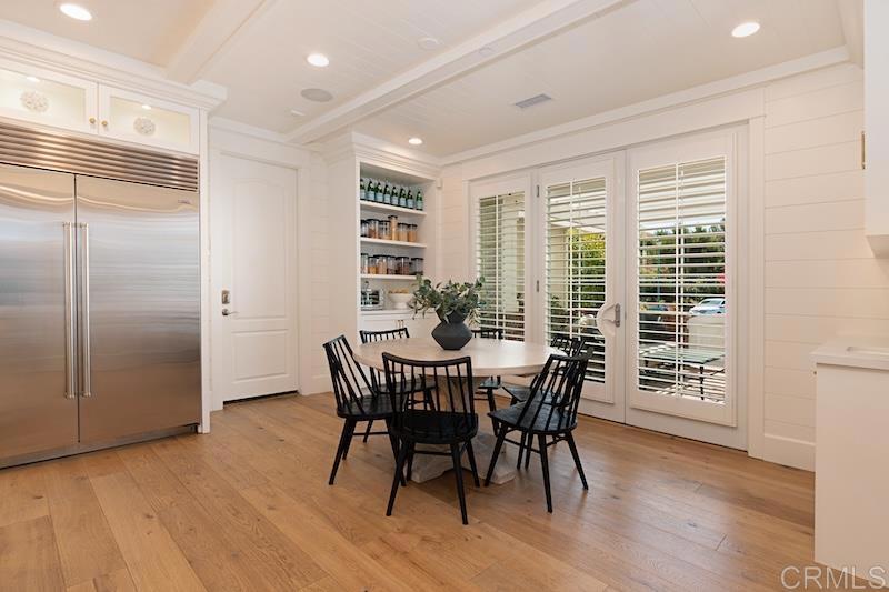 6301 Allston Street Carlsbad, CA 92009 - Photo 13 of 73 a view of a dining room with furniture window and wooden floor