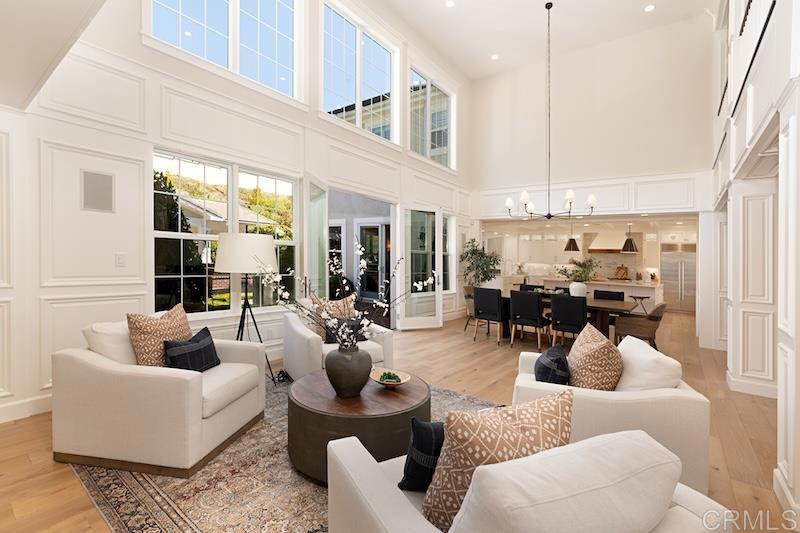 6301 Allston Street Carlsbad, CA 92009 - Photo 6 of 73 a living room with furniture kitchen view and a chandelier