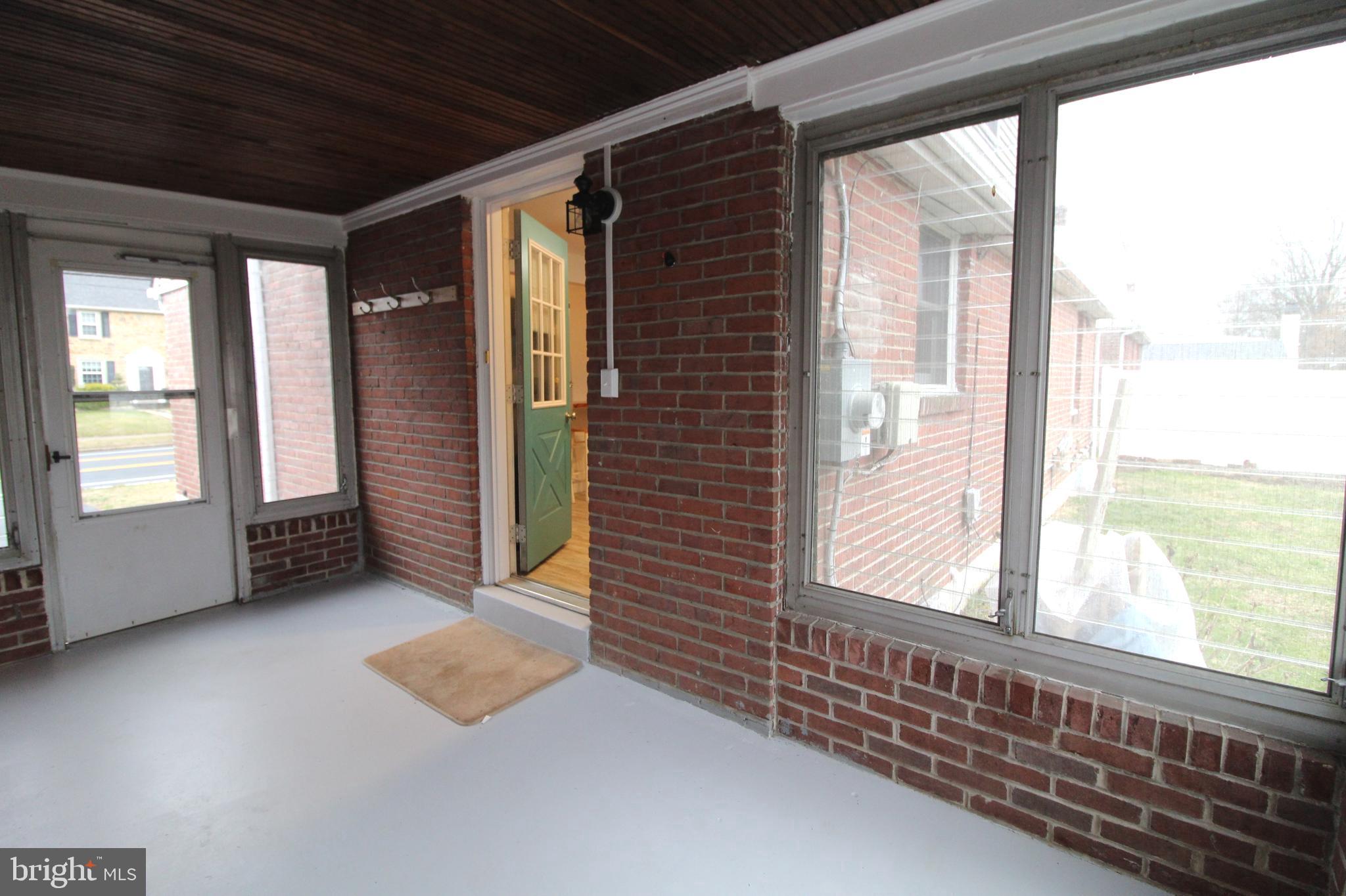117 Murphy Road Wilmington, DE 19803 - Photo 15 of 18 Enclosed Porch with front & rear exterior access