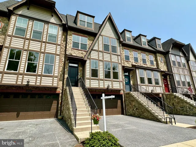 a front view of a house with a porch