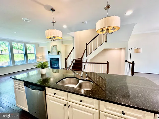 an empty room with a window and a bathroom
