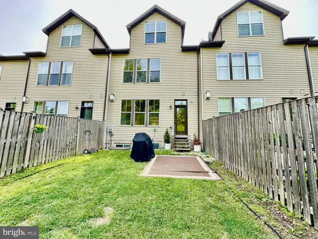 a view of entryway and hall with a door