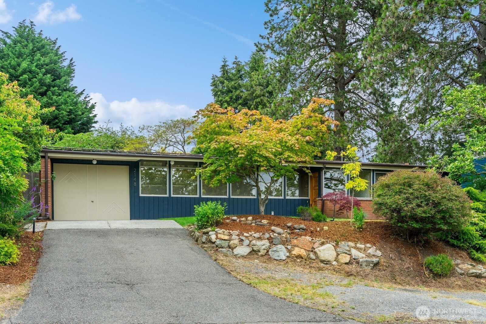 2148 North 115th Street Seattle, WA 98133 - Photo 1 of 26 a front view of a house with garden