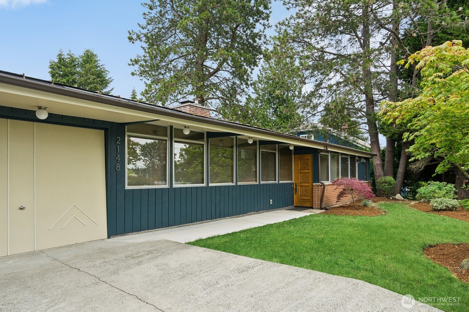 2148 North 115th Street Seattle, WA 98133 - Photo 2 of 26 a front view of house with yard and green space