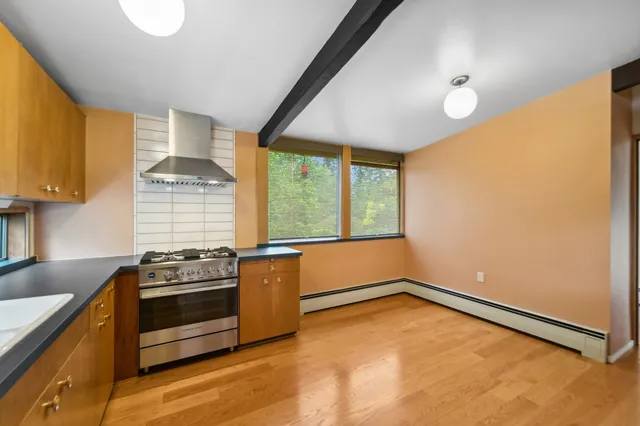 a kitchen that has a sink and a stove